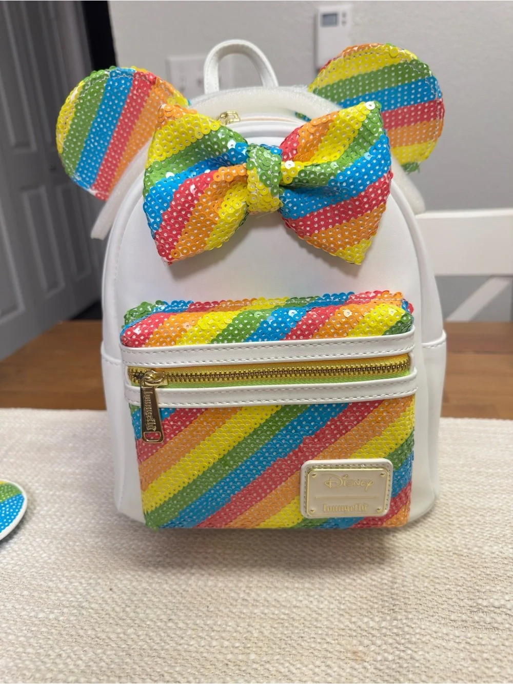 Loungefly White Mini Backpack with Rainbow Sequin Ears and Bow